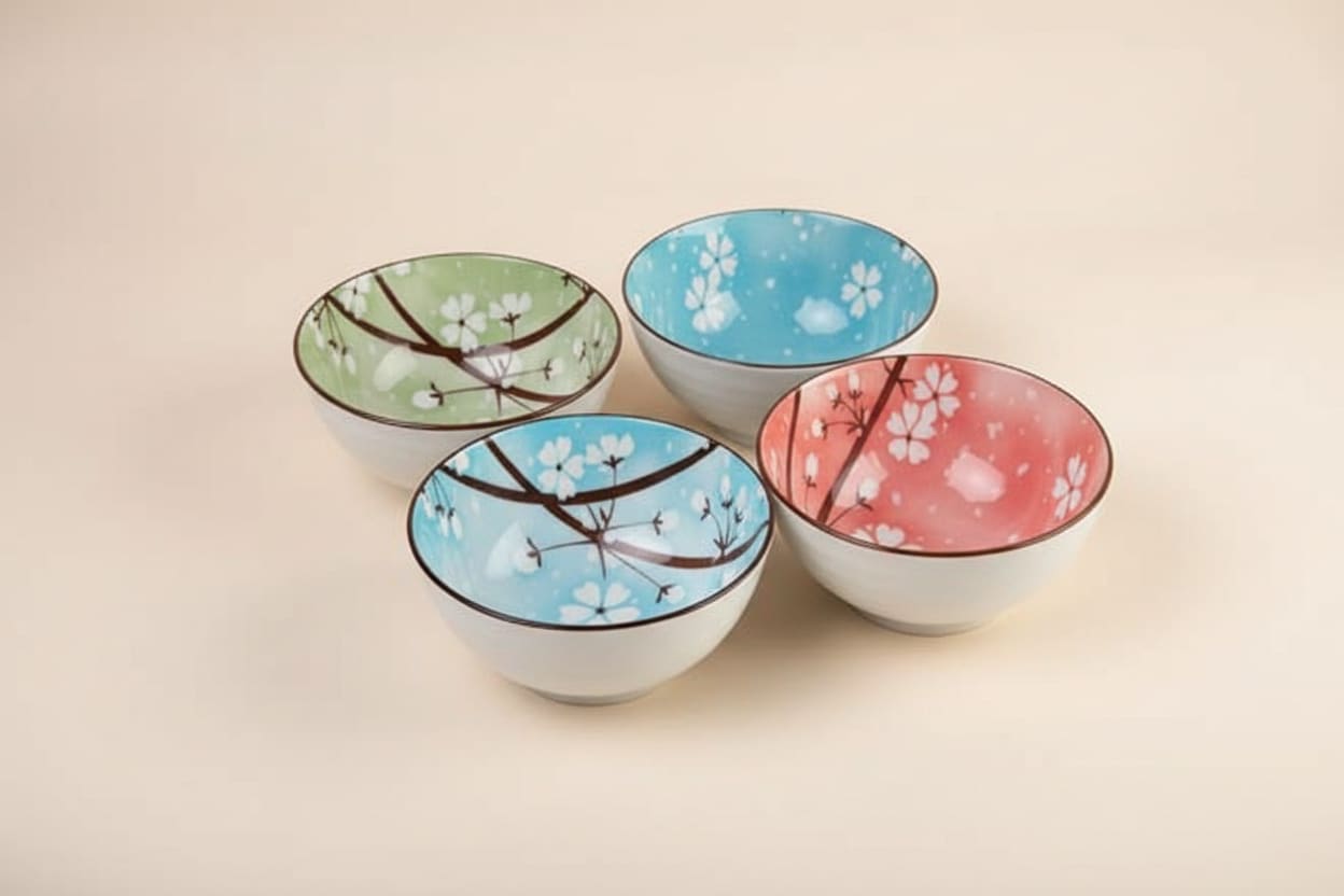Set of four multicolor floral porcelain bowls by CasaHome in a decorative gift box.