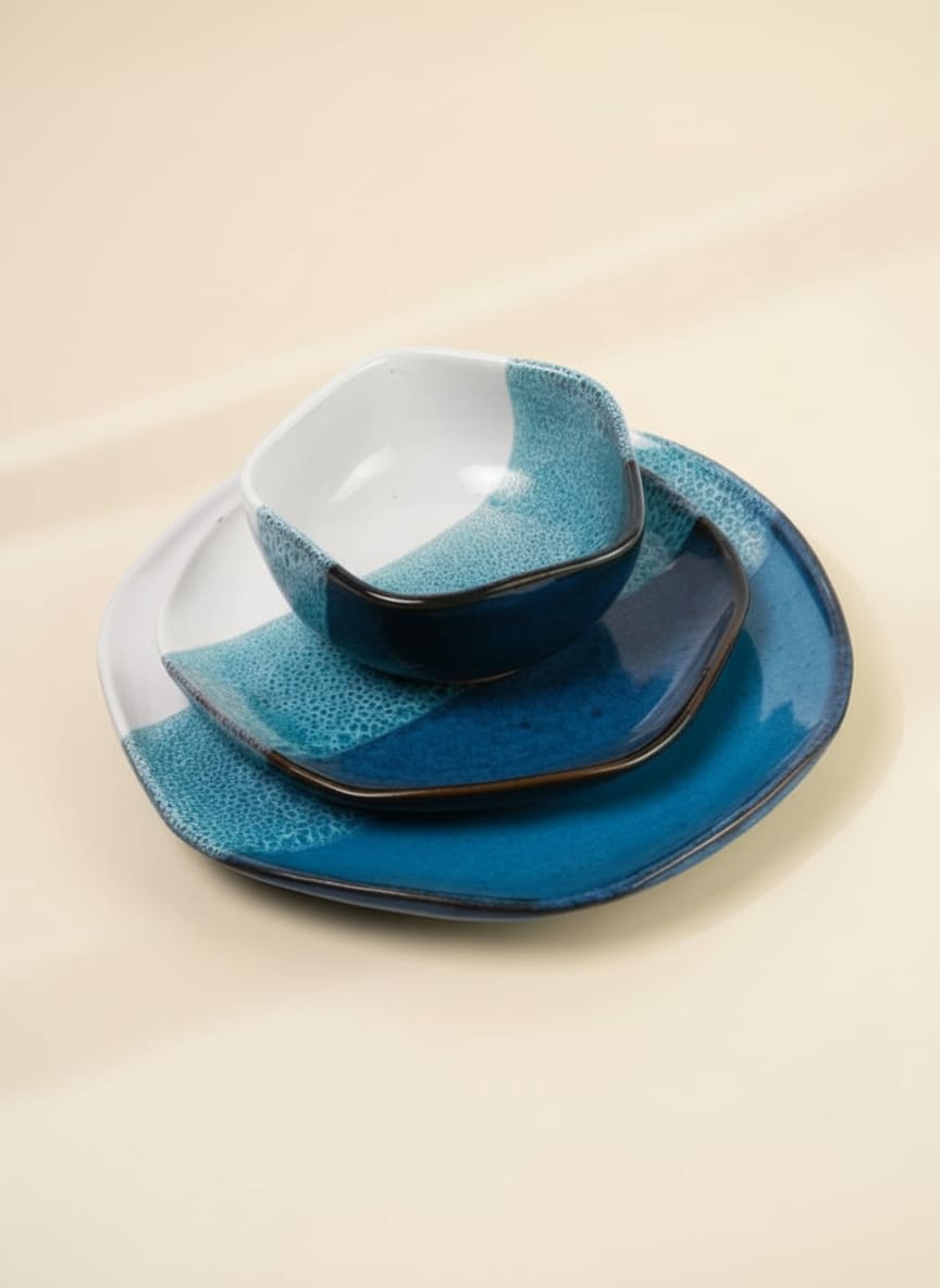 3-piece stoneware dinner set with a blue and white reactive ocean glaze.