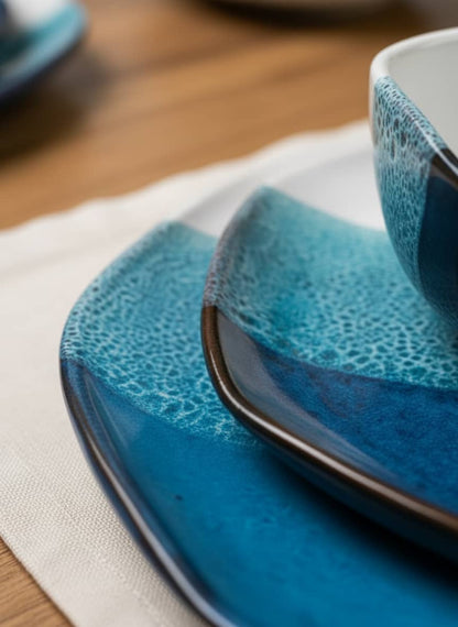Close-up of the textured reactive glaze on a durable, high-quality stoneware plate and bowl.