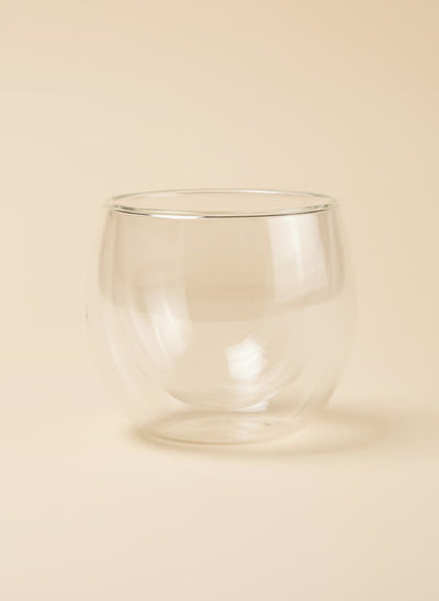 A 250ml double-wall insulated glass cup with a rounded design on a white background.