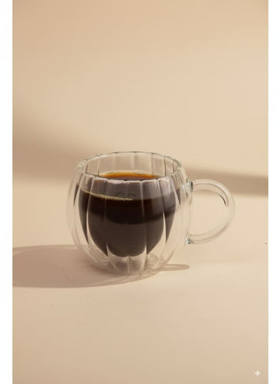 Ribbed double-wall glass mug filled with black coffee on a white background, perfect for Egyptian homes.