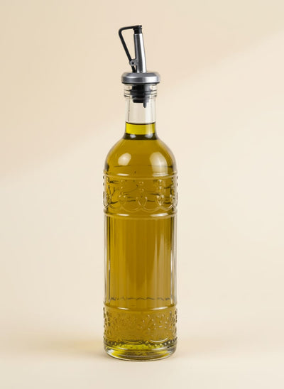 Elegant 500ml carved glass olive oil dispenser with a stainless steel drip-free pourer.
