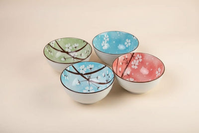 Set of four multicolor floral porcelain bowls by CasaHome in a decorative gift box.