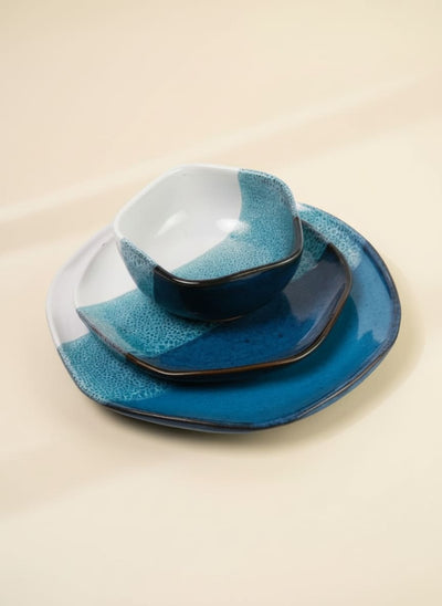 3-piece stoneware dinner set with a blue and white reactive ocean glaze.