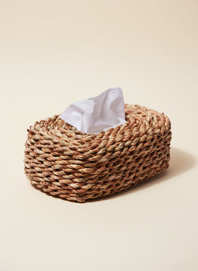 Woven halfa grass tissue box cover with a white tissue, set against a clean white background.