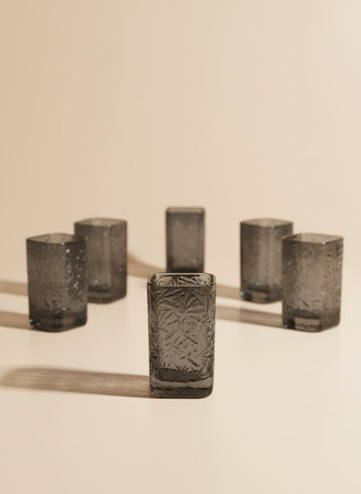 Set of six 250ml square smoke glass drinking cups with a textured geometric pattern on a white background.
