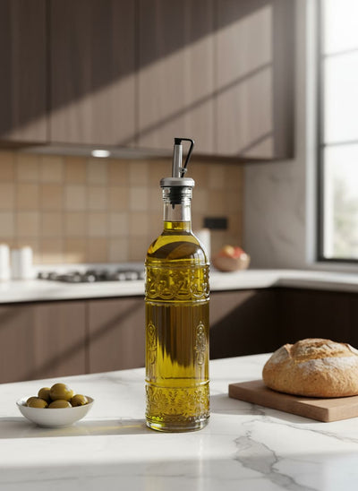 A beautiful glass bottle for serving olive oil or vinegar on an Egyptian family dining table.