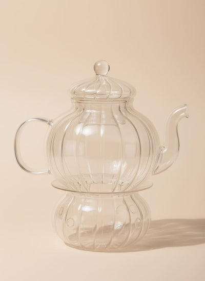 Ribbed glass teapot with matching warmer base, 600ml capacity, made from clear borosilicate glass.