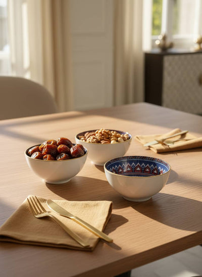 Elegant table setting for a family meal in Egypt featuring a stack of patterned porcelain bowls.