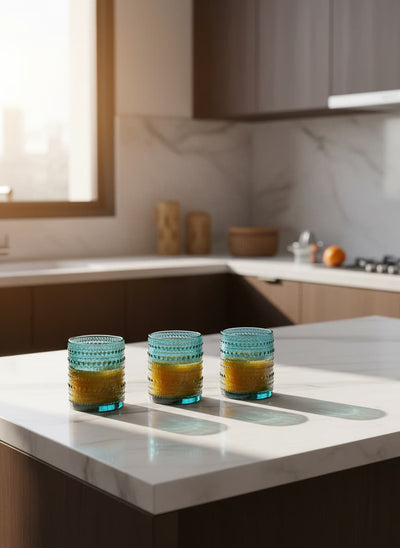 Elegant turquoise drinking glasses, perfect for serving fresh juice at family gatherings in Egypt.