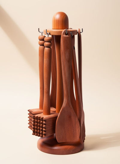 Complete wooden kitchen utensil set with a rotating carousel stand.