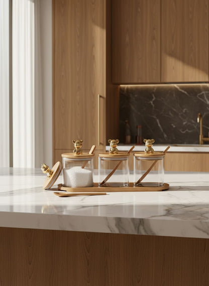 Elegant kitchen storage set with polished golden bear handles on natural bamboo lids, adding a touch of charm.