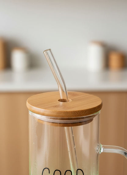 Close-up of the leak-proof natural bamboo lid and clear glass straw on the Good Morning coffee mug.