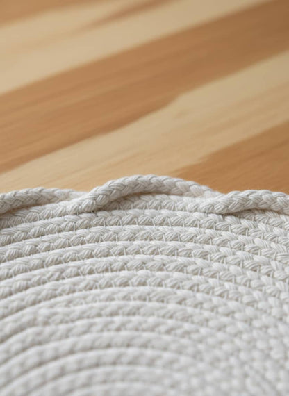 Close-up view of the thick, tightly woven cotton braids of a durable heat-resistant pot holder.